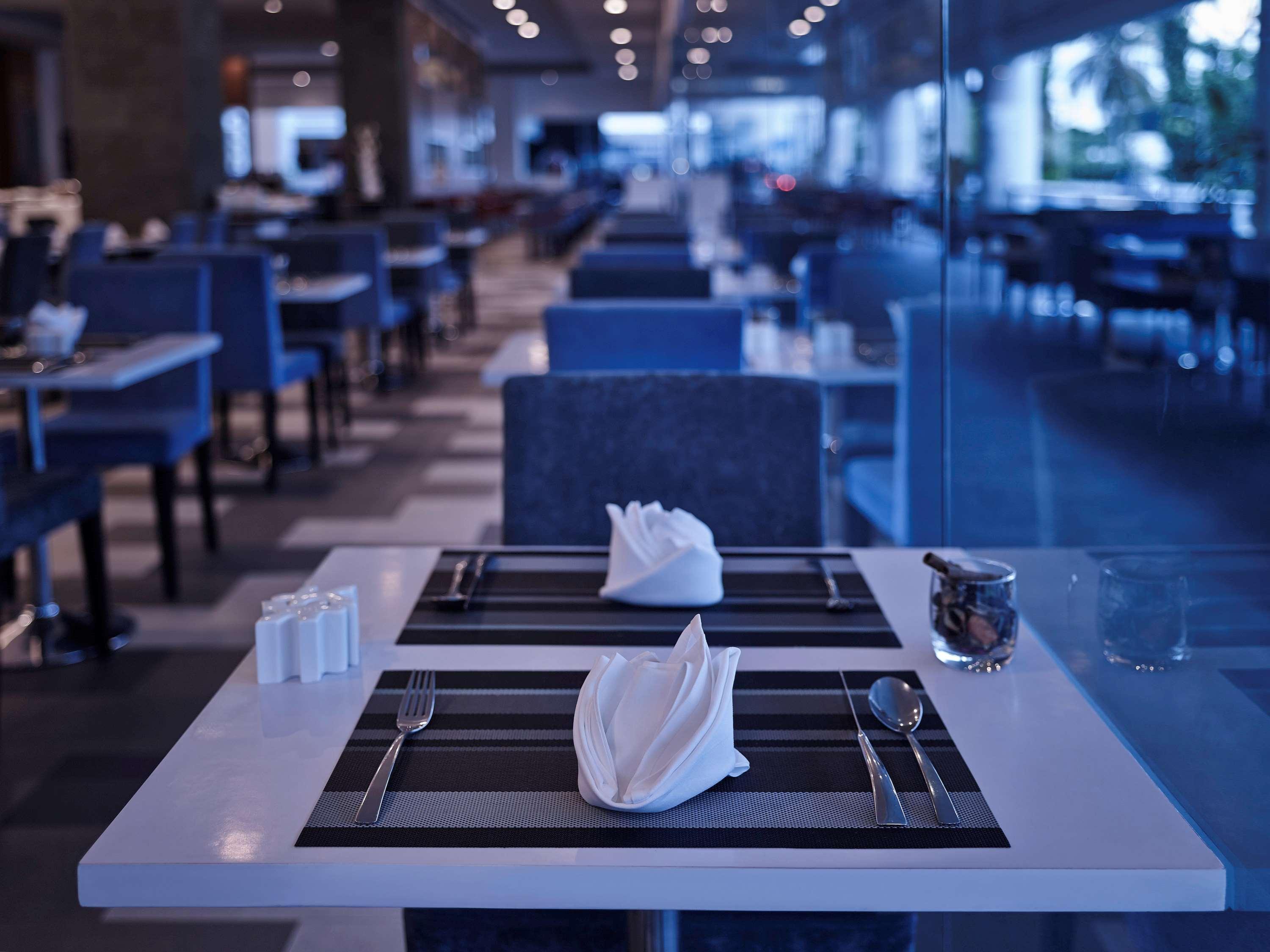 Pullman Kuching Hotell Exteriör bild A place setting at a restaurant