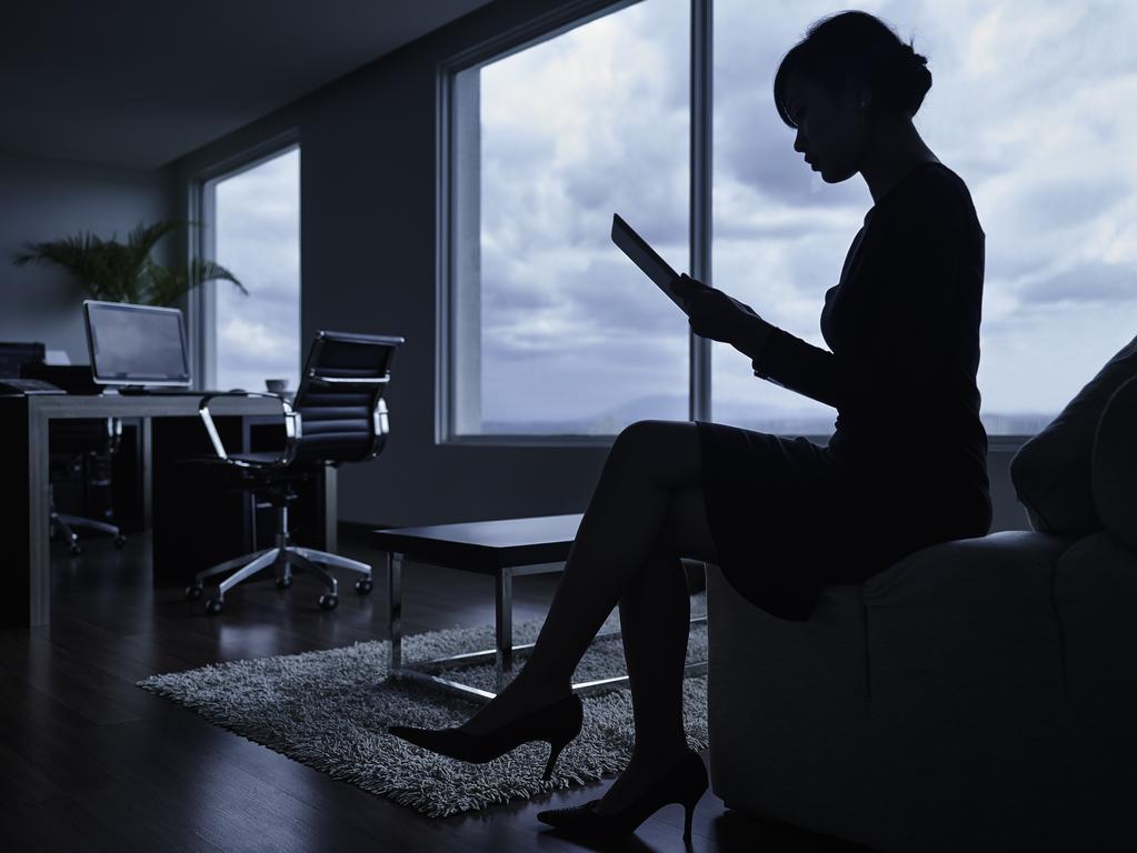 Pullman Kuching Hotell Exteriör bild A woman working in a dark office